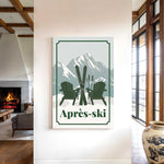 a cozy indoor setting with a fireplace, a large vase, and a framed poster of two green Adirondack chairs with skis on them, along with the text "Apres-ski" (ski resort).