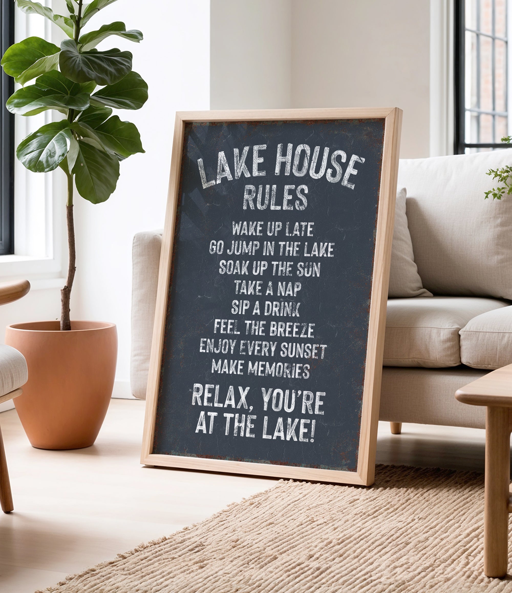 A chalkboard sign in a living room displaying the "Lake House Rules" for guests to follow.