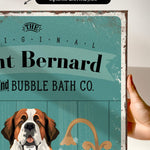 a hand holding a framed print with a dog illustration on it.