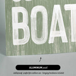 a green and white sign that says go on a boat