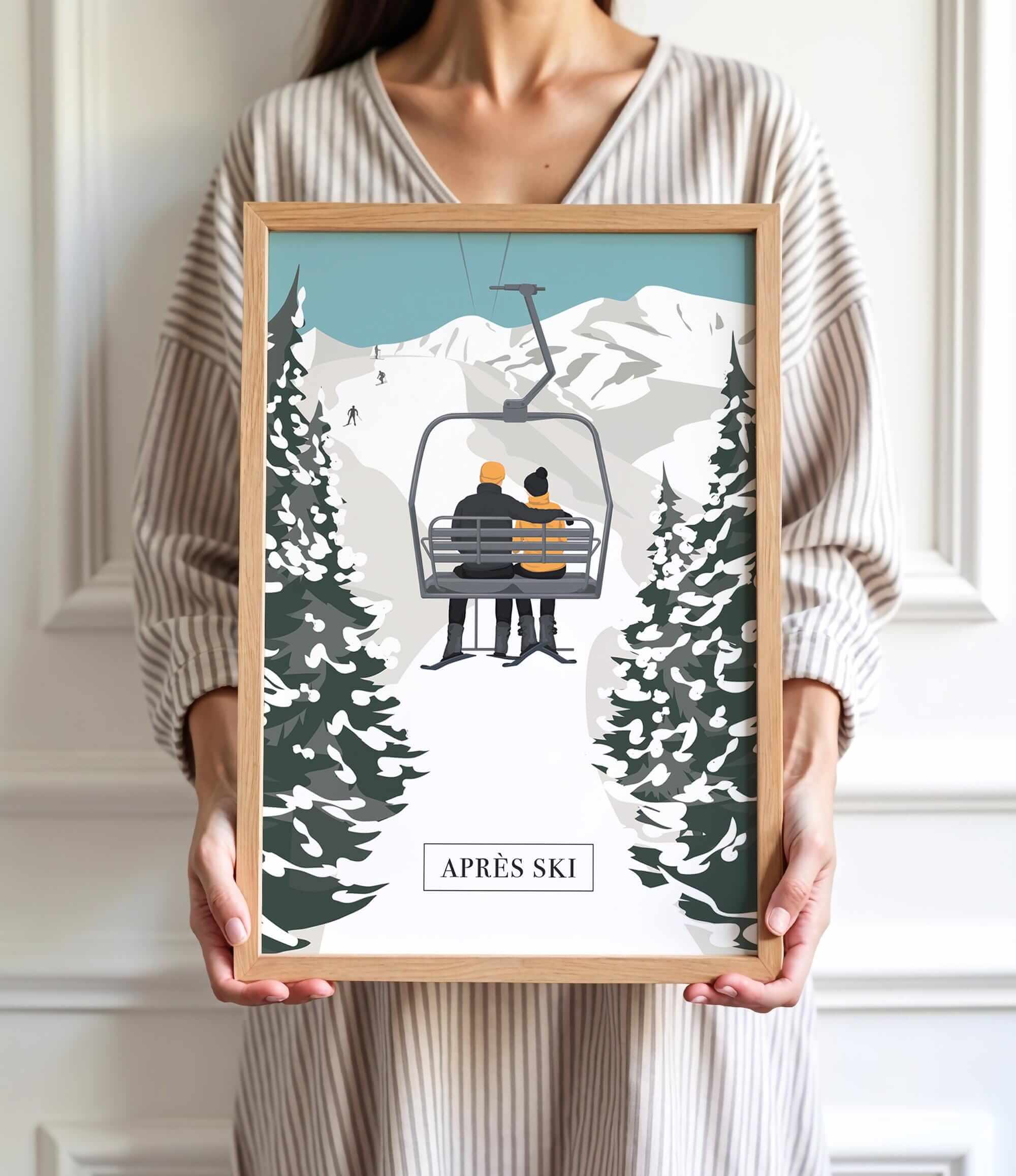 A person is holding a framed picture of a couple on a ski lift, surrounded by snow-covered trees, with the word "APRÈS" visible.