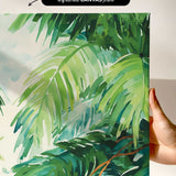 a close-up view of a vibrant, lush tropical plant with large, green leaves. The plant appears to be a type of palm or fern, with intricate patterns and textures. The background is a light green color, providing a contrast to the vivid foliage. The image is described as an "unframed canvas print" and "a hand holding it", suggesting that it is a printed artwork being held by someone.