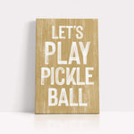 a wooden sign that says let's play pickle ball