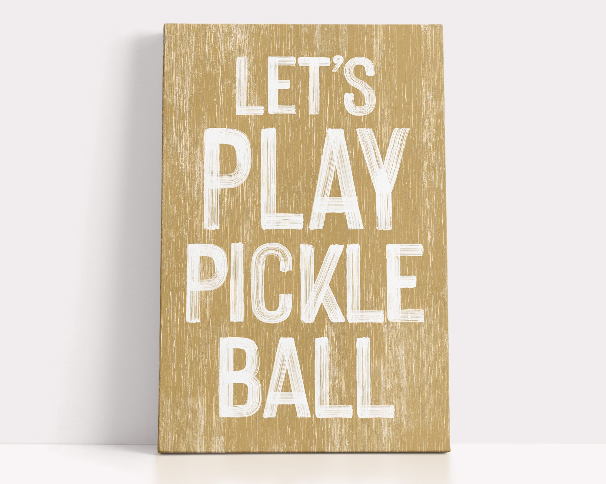 a wooden sign that says let's play pickle ball