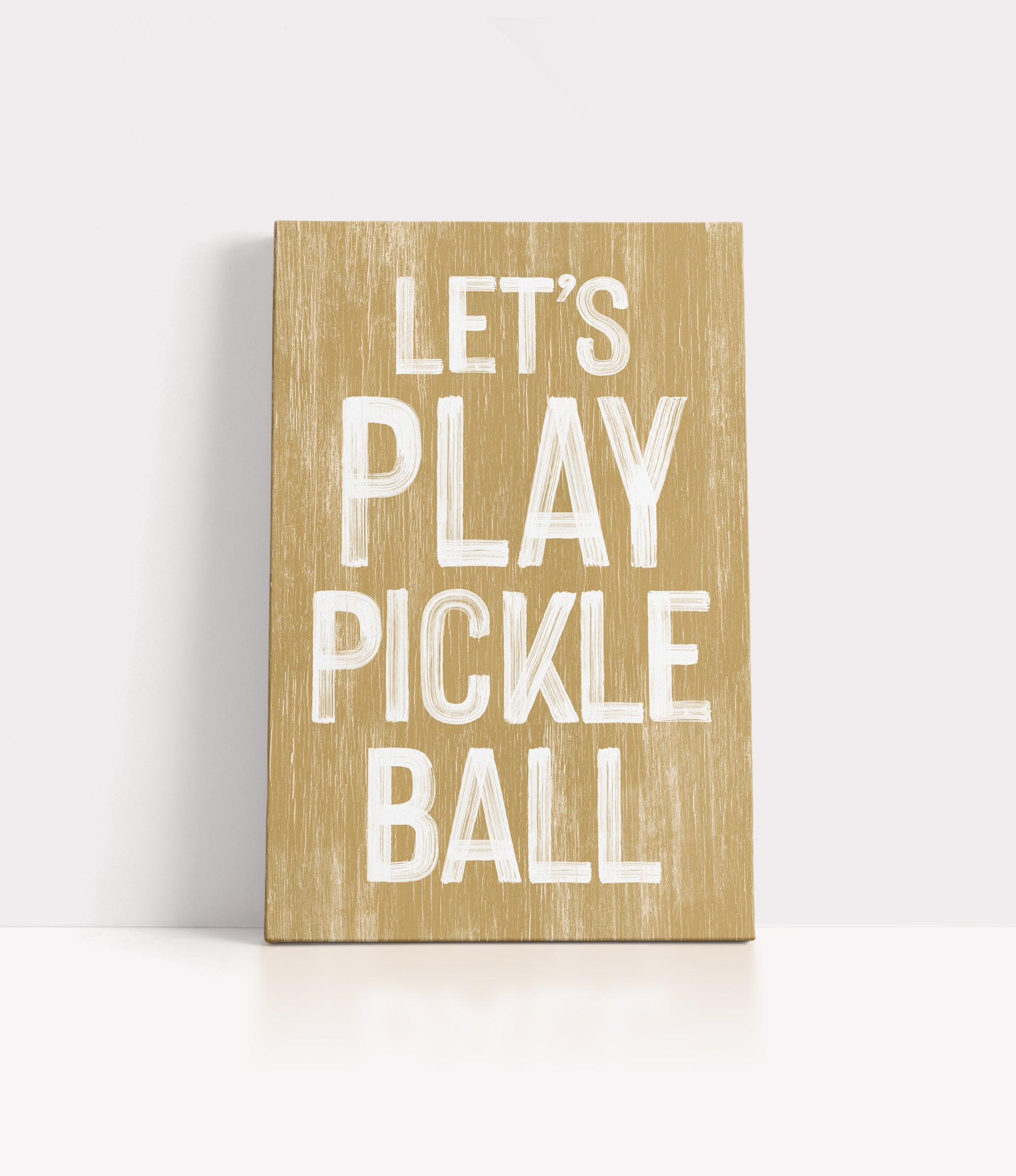 a wooden sign that says let's play pickle ball