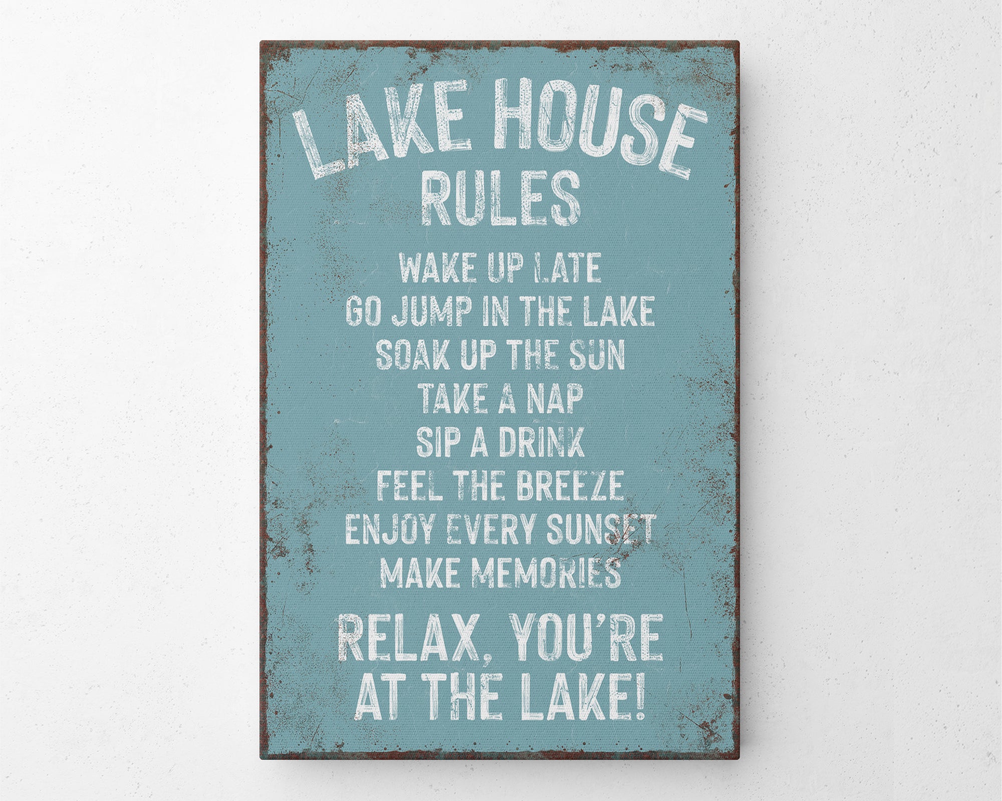 a sign on a wall that says lake house rules