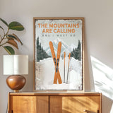 a poster of skis on a dresser next to a lamp