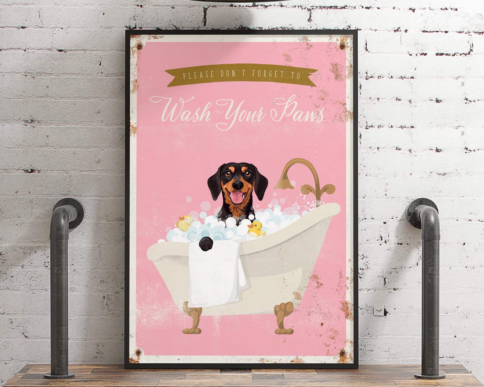 A framed poster with a dog sitting in a bathtub filled with bubbles, accompanied by the text "Please don't forget to wash your paws".