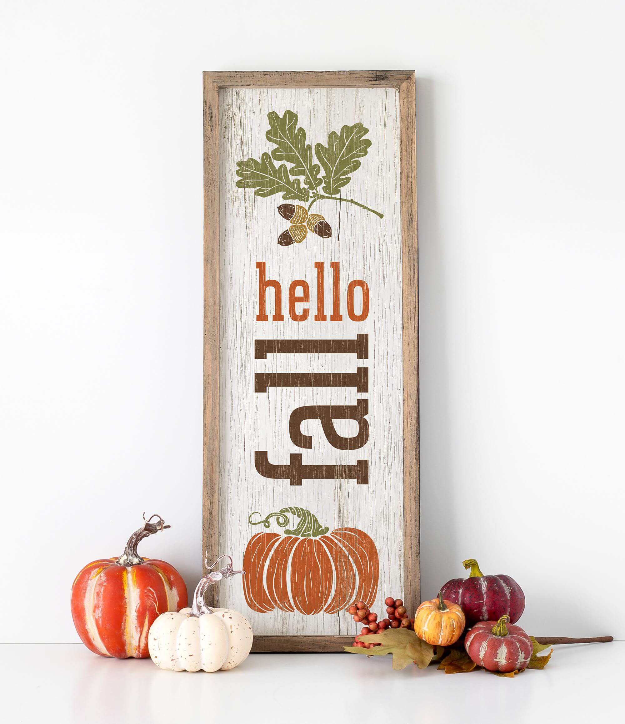 a wooden sign that says hello fall with pumpkins and acorns