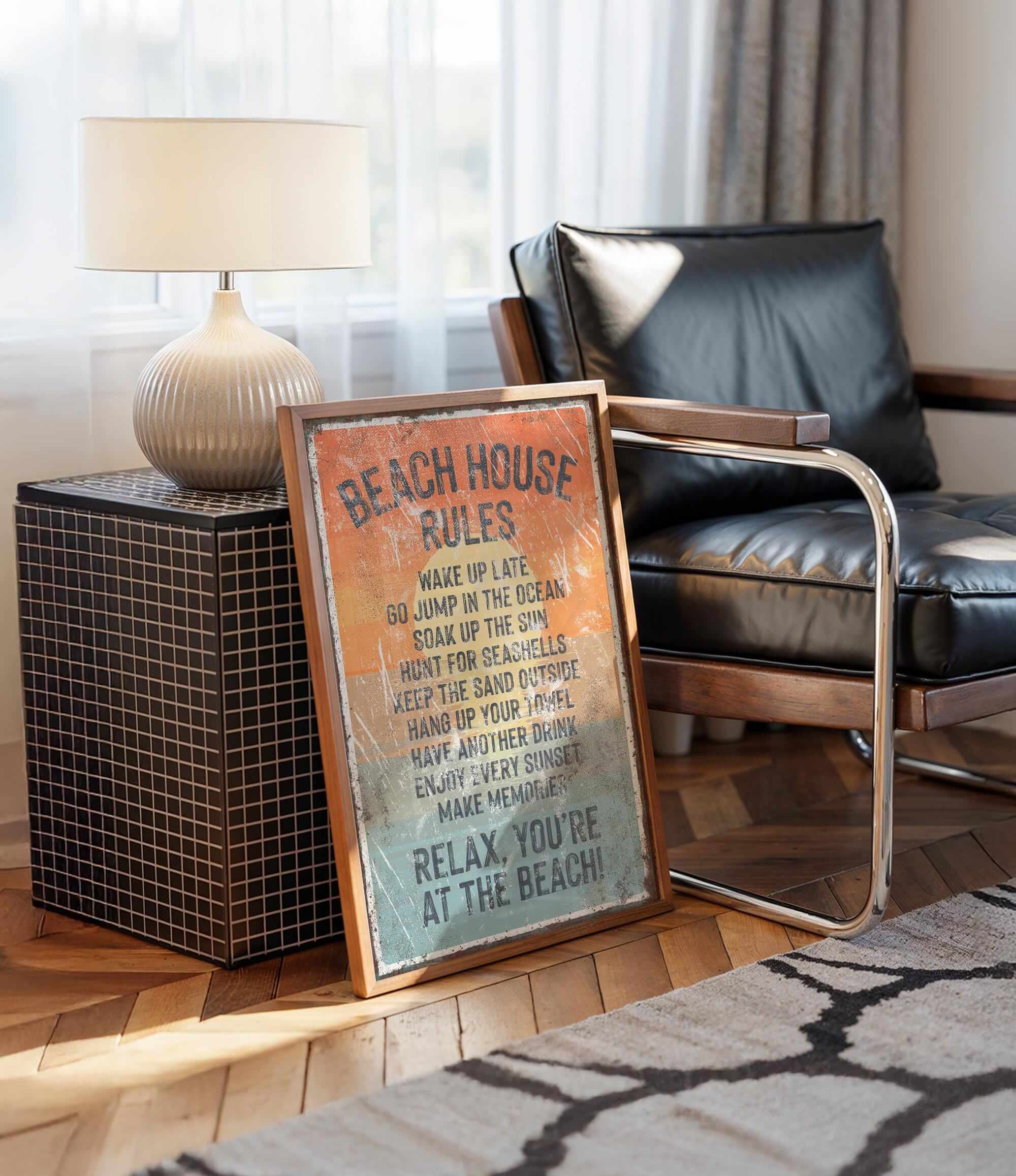a framed sign with beach rules, placed on a wooden floor next to a black leather chair.