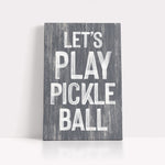 a wooden sign that says let's play pickle ball