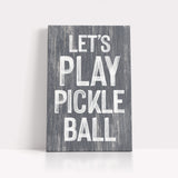 a wooden sign that says let's play pickle ball