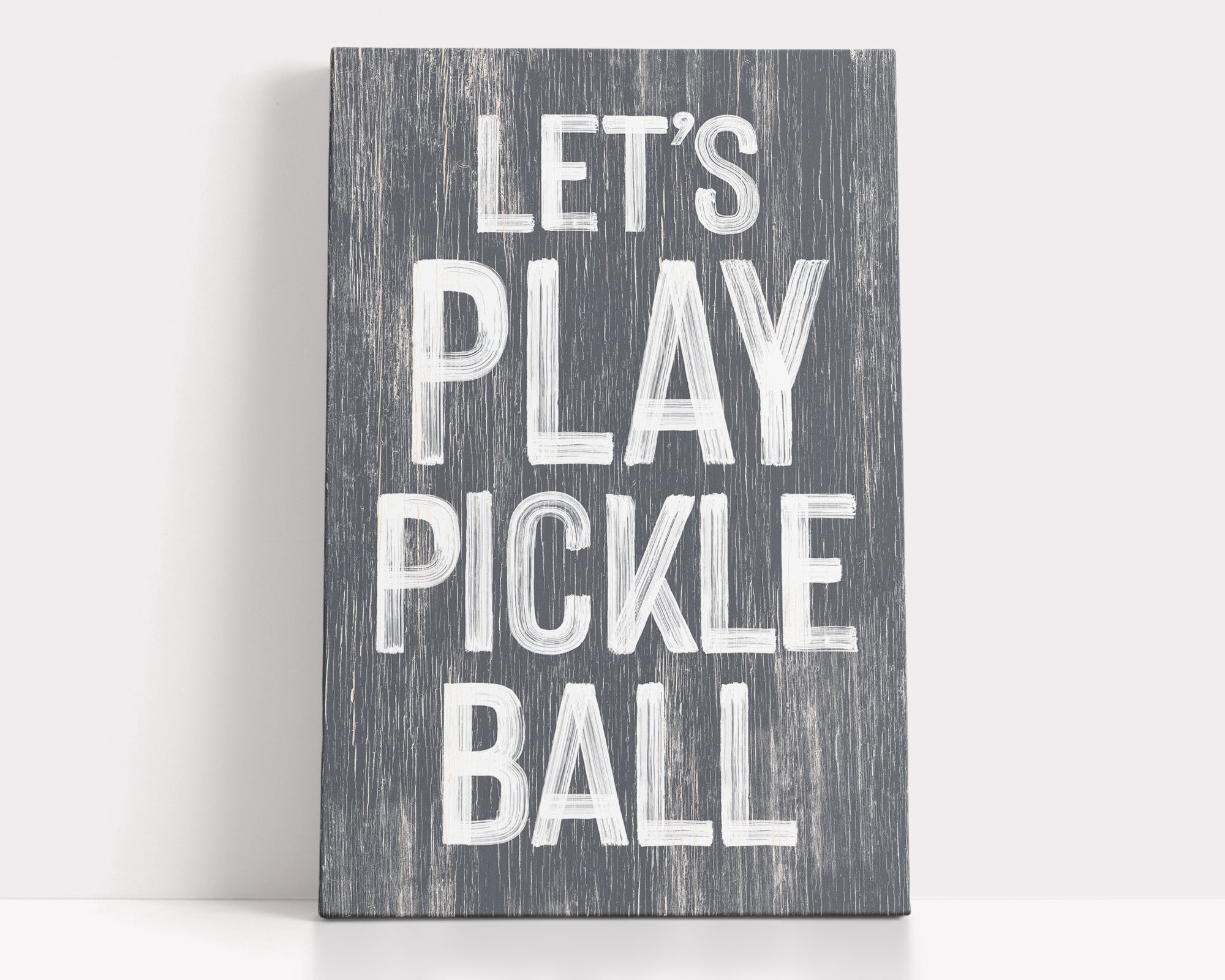 a wooden sign that says let's play pickle ball