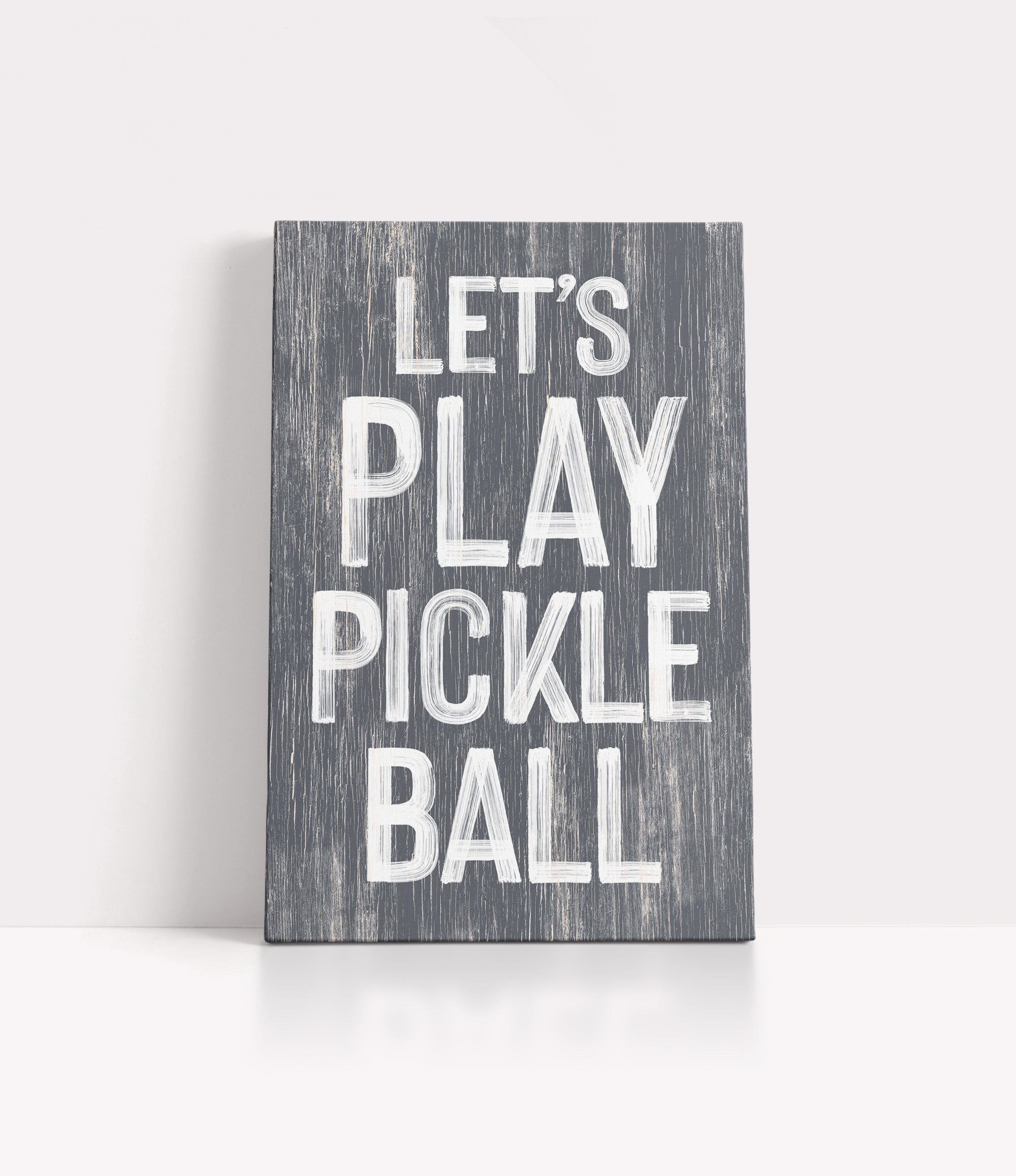 a wooden sign that says let's play pickle ball