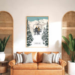 a cozy living room with a brown leather couch adorned with striped pillows, a framed poster of a ski lift, and two potted plants on either side of the couch.