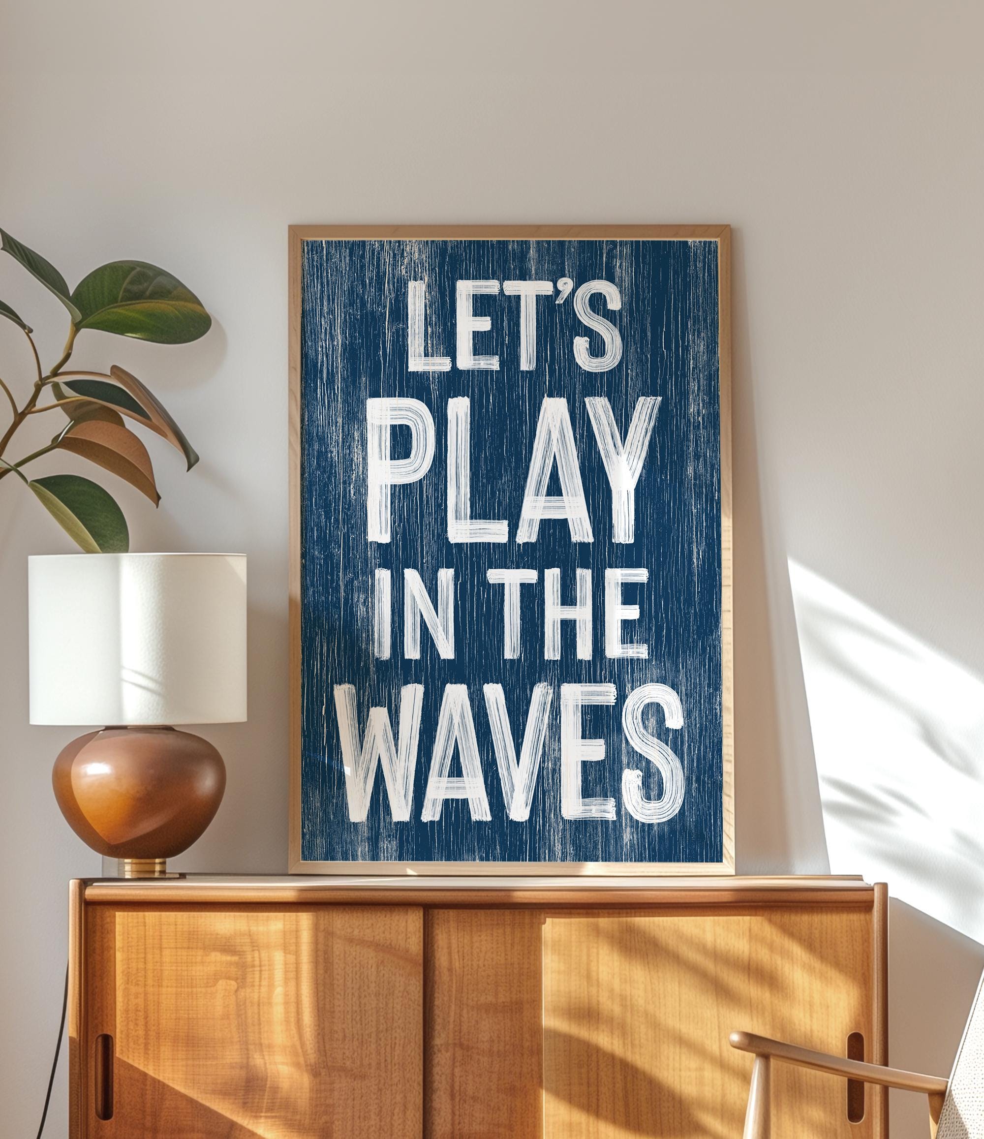 a blue sign that says let&#39;s play in the waves