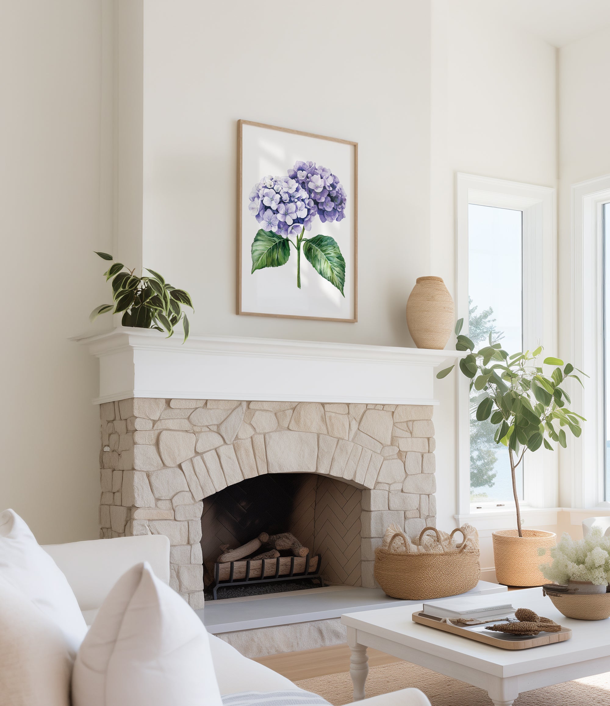 a cozy living room with a stone fireplace, a framed watercolor painting of purple hydrangeas hanging above it, and a white sofa. The room is decorated with potted plants and a woven basket, creating a warm and inviting atmosphere.