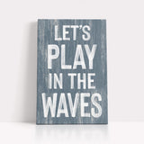 a wooden sign that says let&#39;s play in the waves
