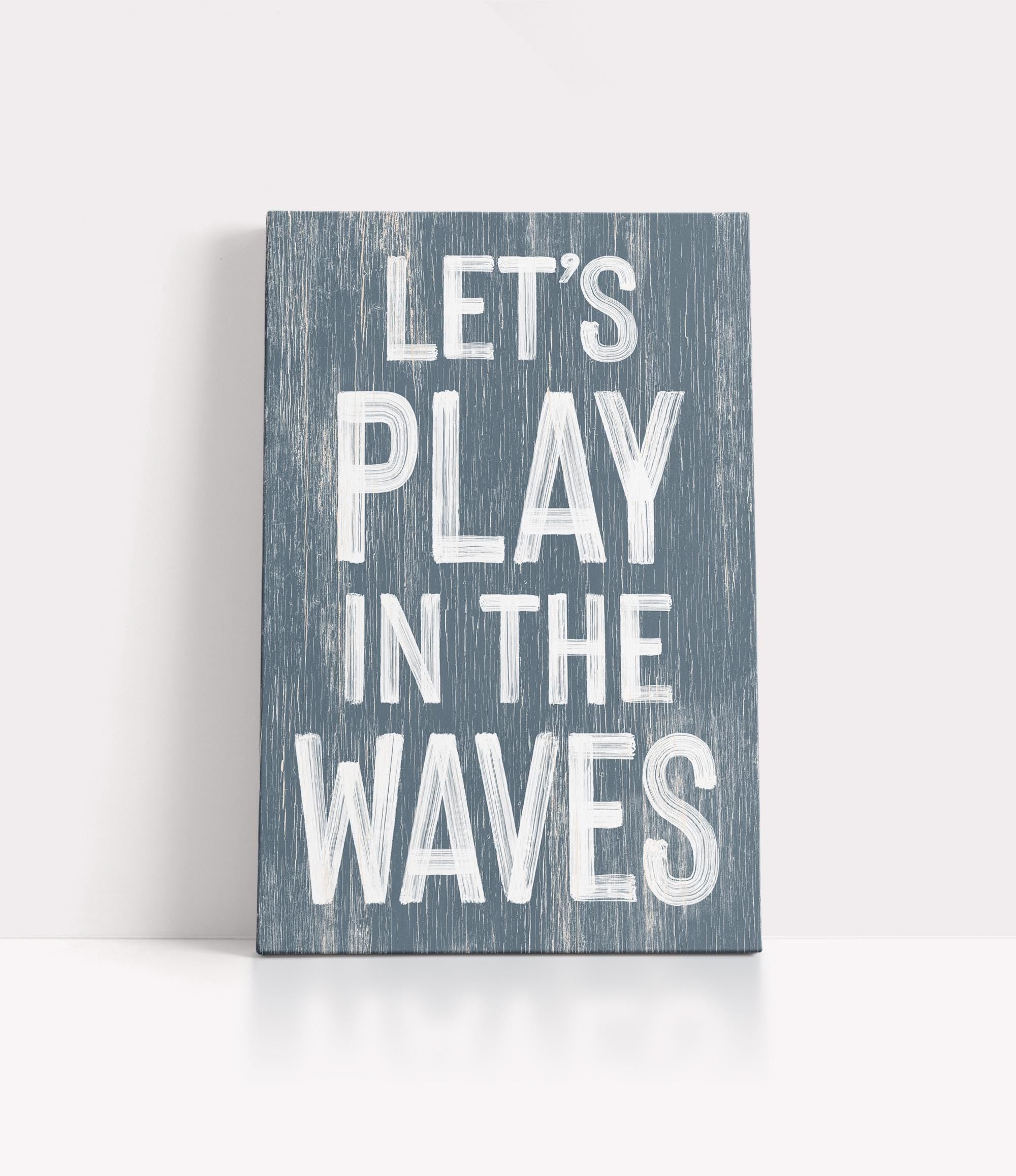 a wooden sign that says let&#39;s play in the waves