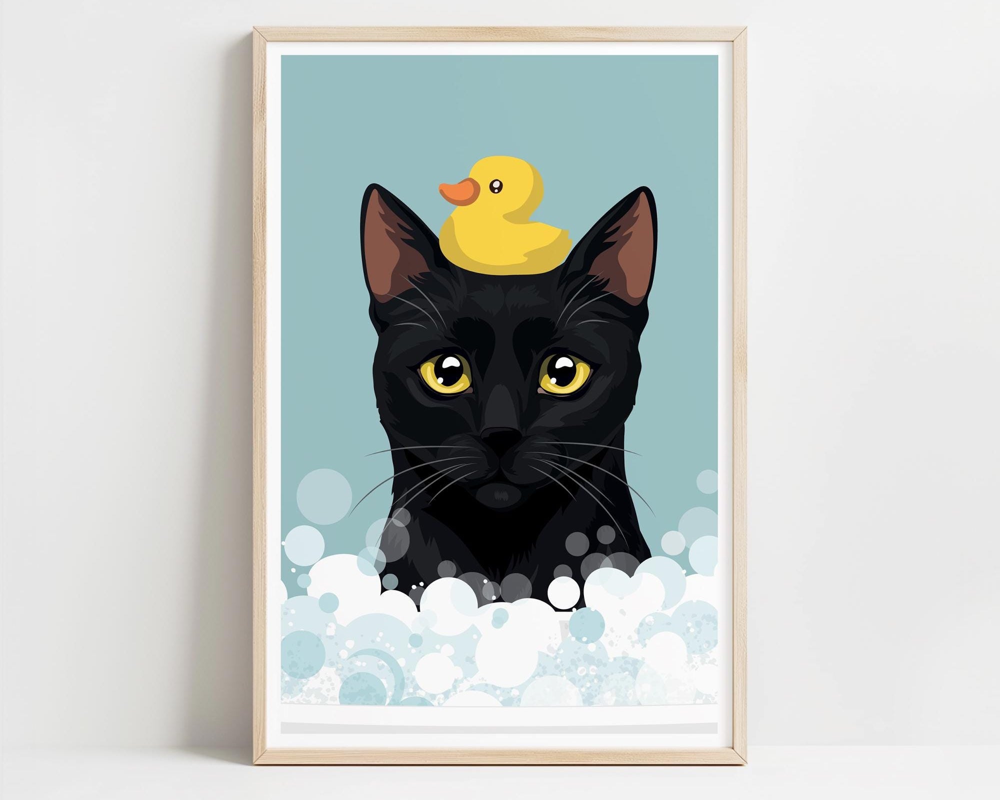 A framed illustration of a black cat with a yellow rubber duck perched on its head, surrounded by bubbles.