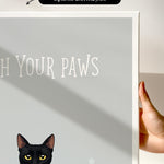 a black cat with yellow eyes, and the text "Witch Your Paws" is displayed on a white background.