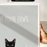 a black cat with yellow eyes, and the text "Witch Your Paws" is displayed on a white background.
