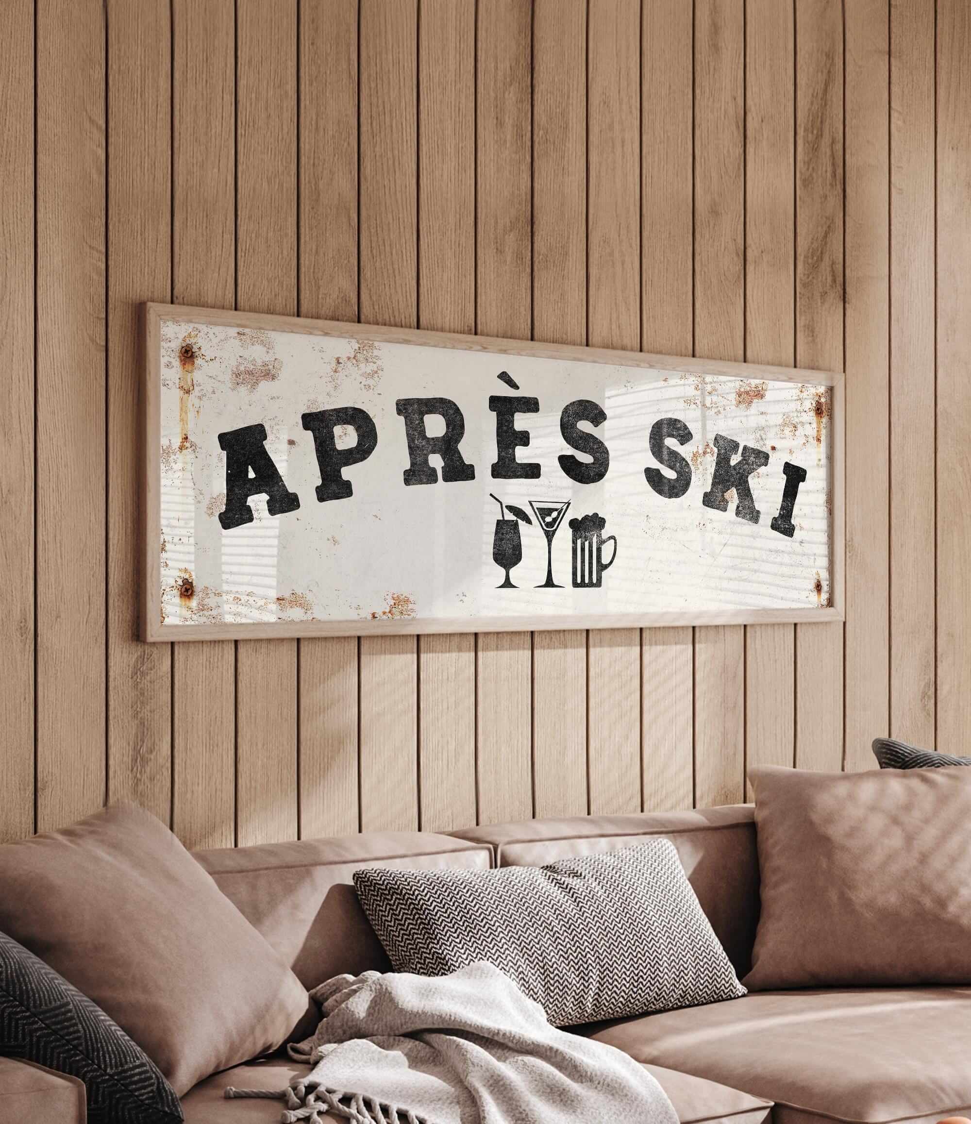 a wooden wall with a framed sign that reads "APRÈS SKI", accompanied by a beer mug and a wine glass icon.