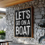 a sign that says let&#39;s go on a boat on a stone wall