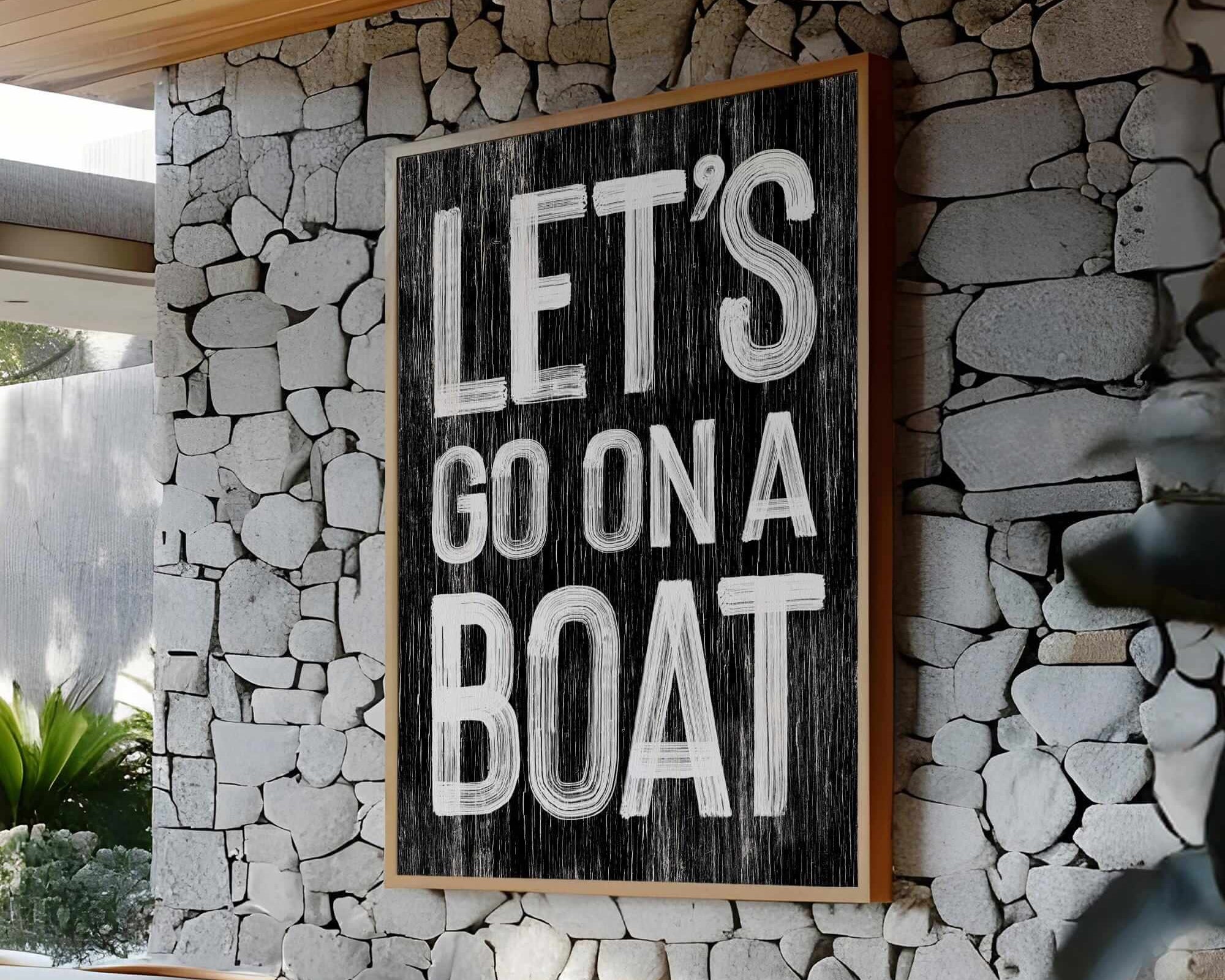 a sign that says let's go on a boat on a stone wall