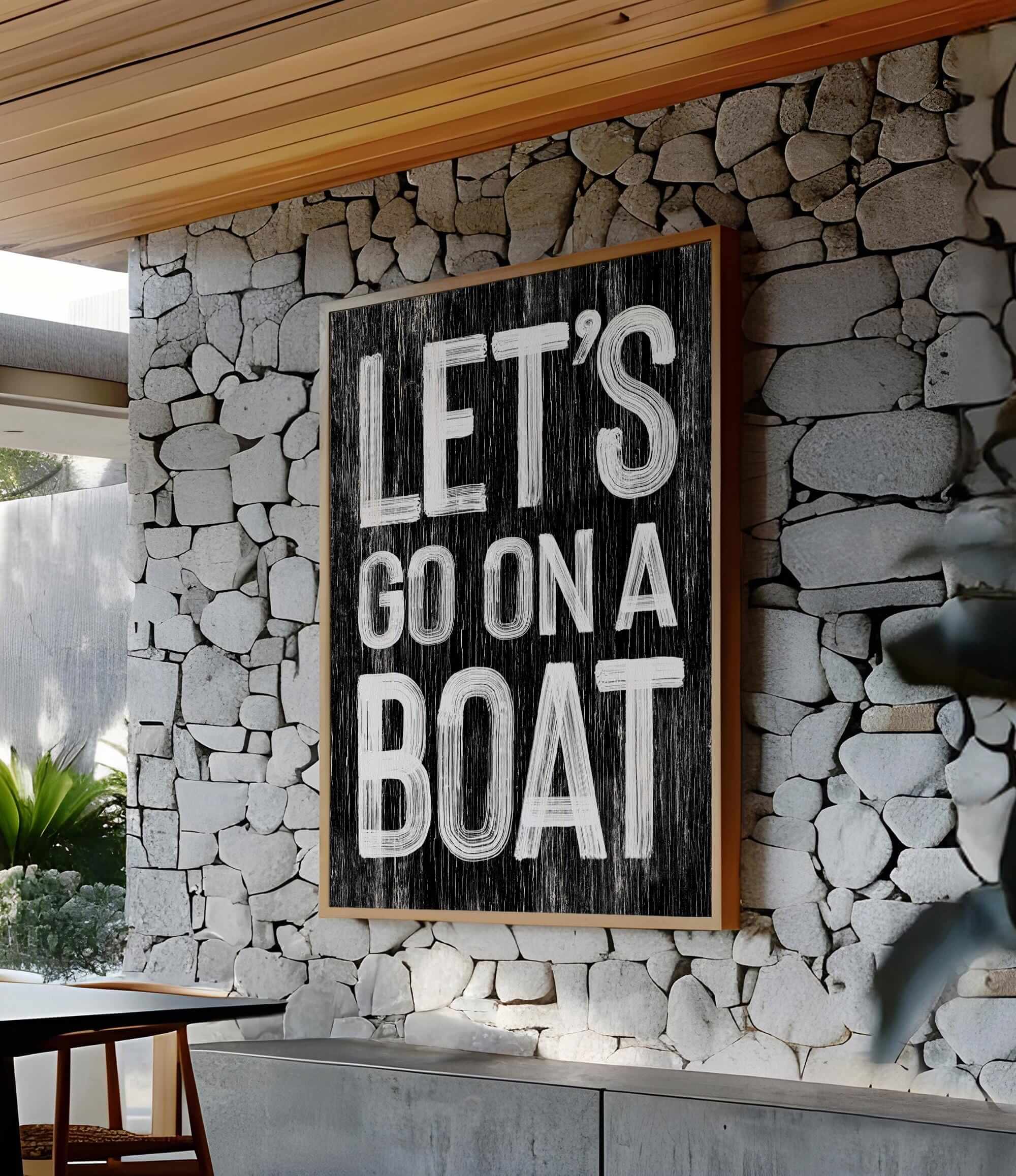 a sign that says let&#39;s go on a boat on a stone wall