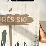 a hand holding a sign that says tres ski