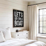 a bedroom with a bed, dresser and window
