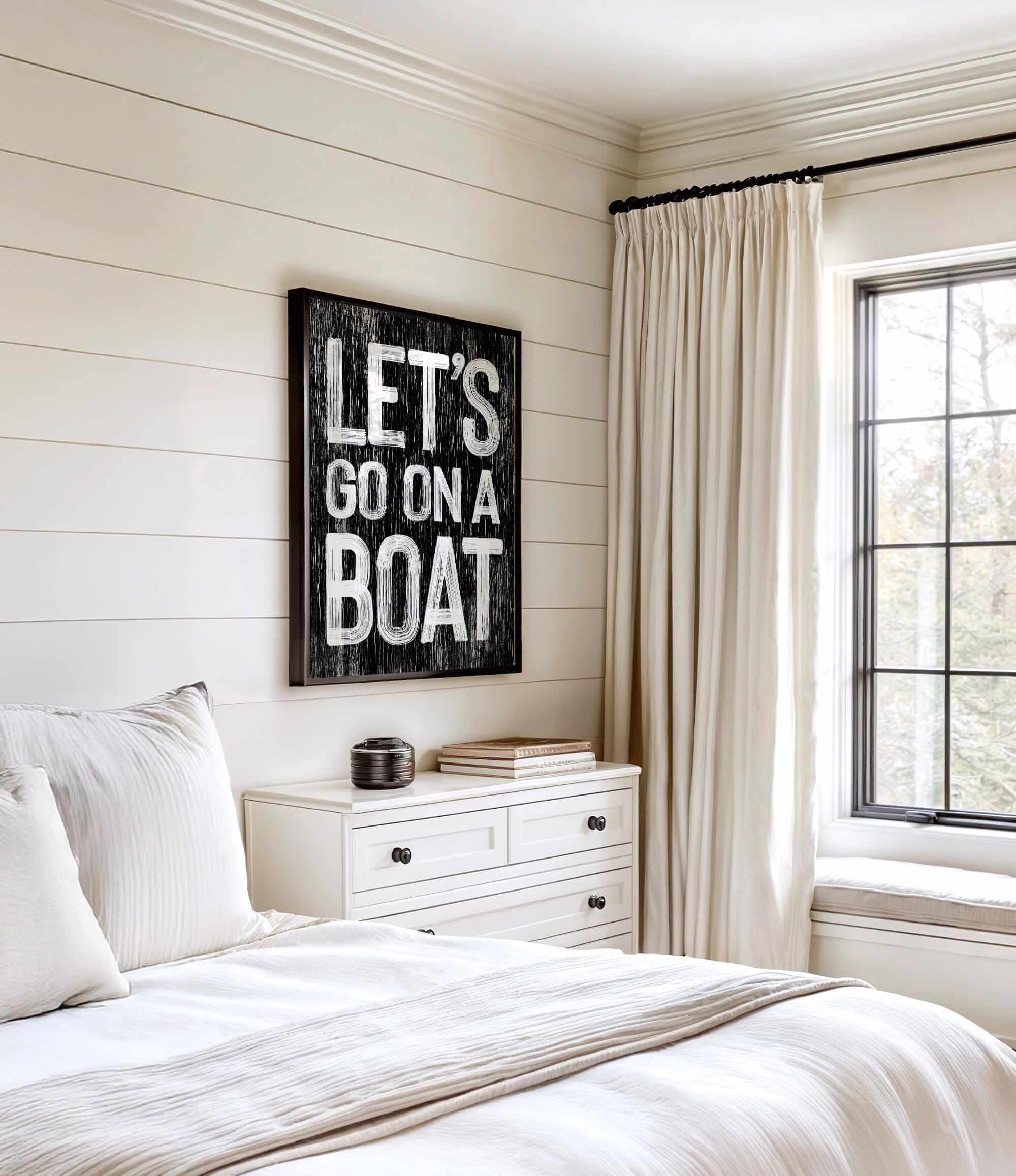 a bedroom with a bed, dresser and window