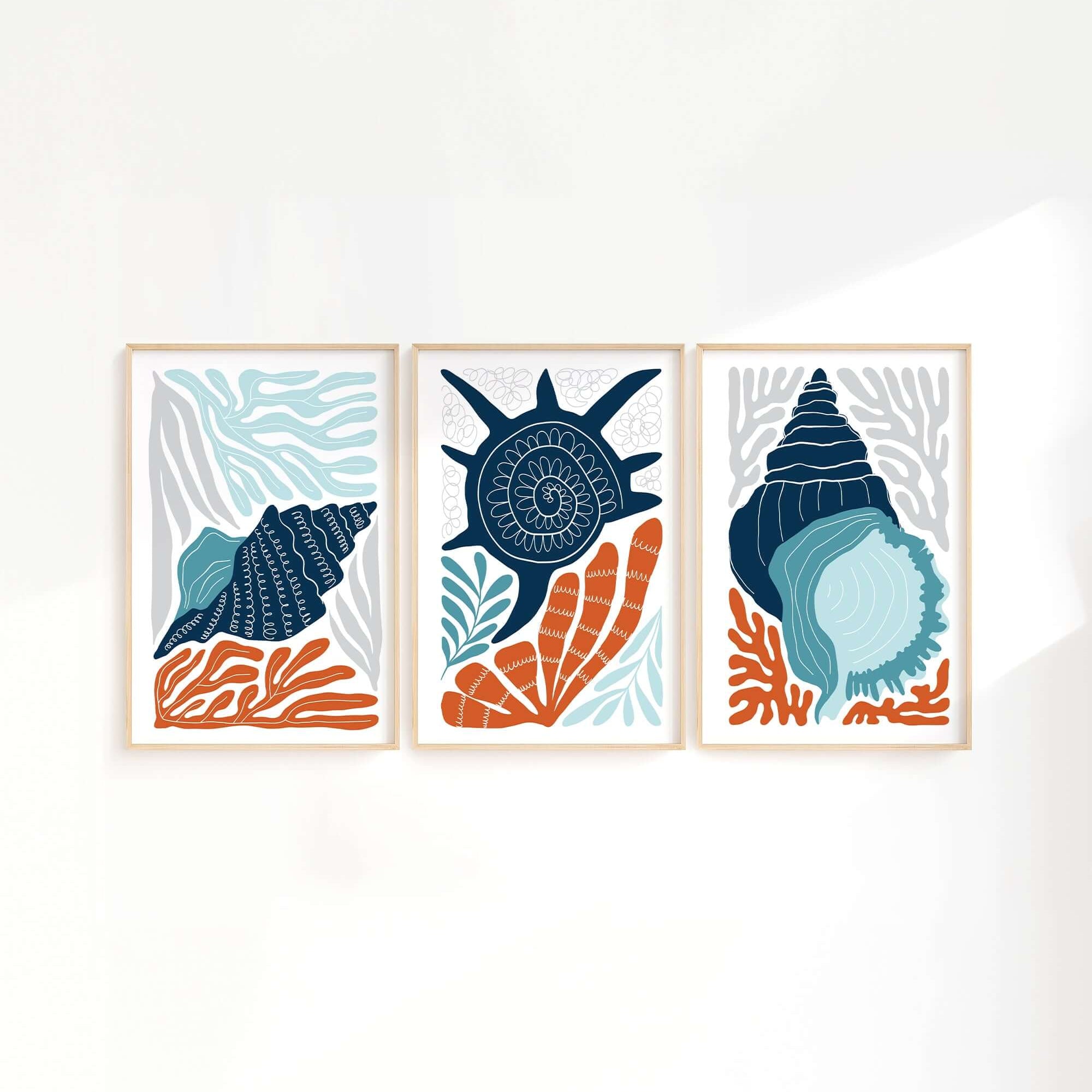 The Ocean Blocks Triptych | Set of Three Prints | 328 showcases abstract blue seashells and orange coral, ideal as wall art to enhance your stylish home decor.