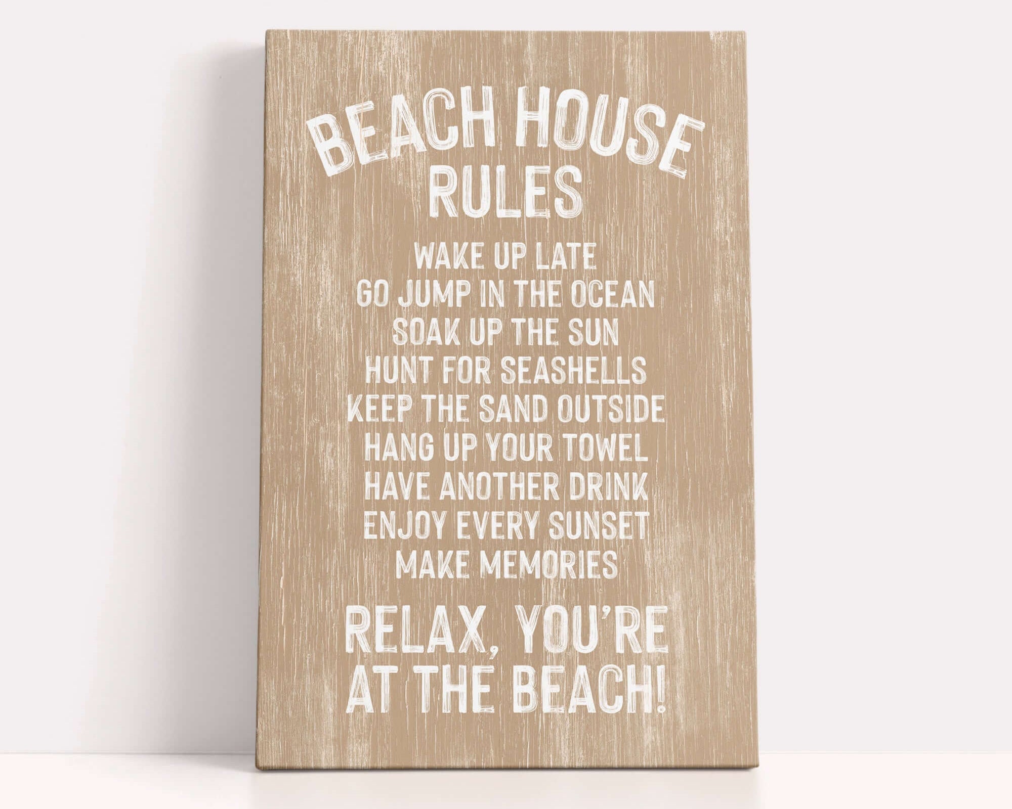 a wooden sign with white text that provides beach house rules, including guidelines for guests to follow while at the beach.