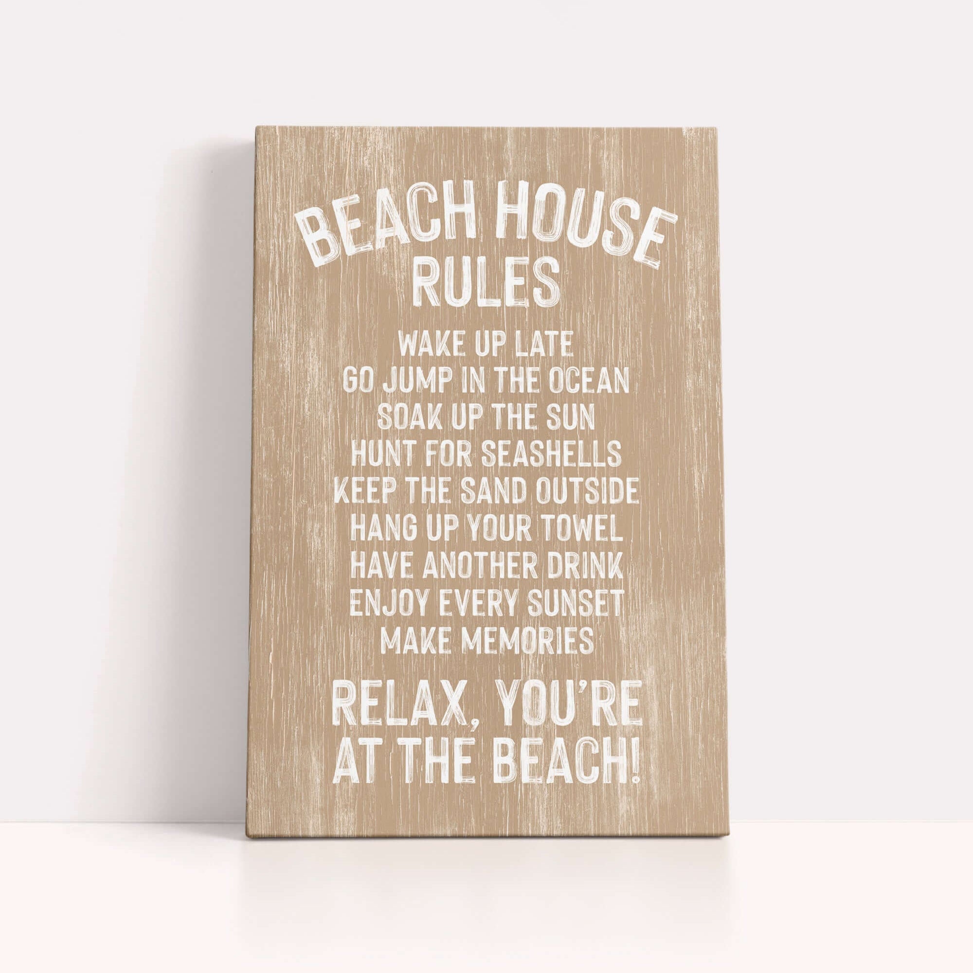 a wooden sign with white text that provides beach house rules, including guidelines for guests to follow while at the beach.