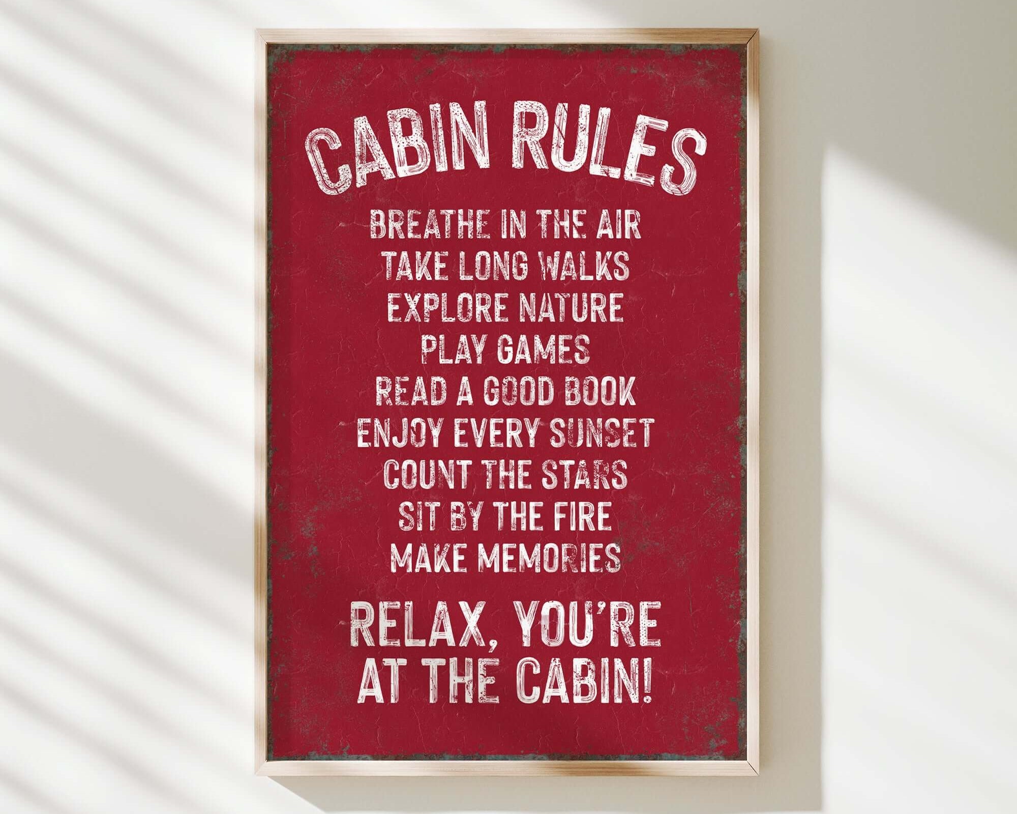 a red sign that says cabin rules hanging on a wall