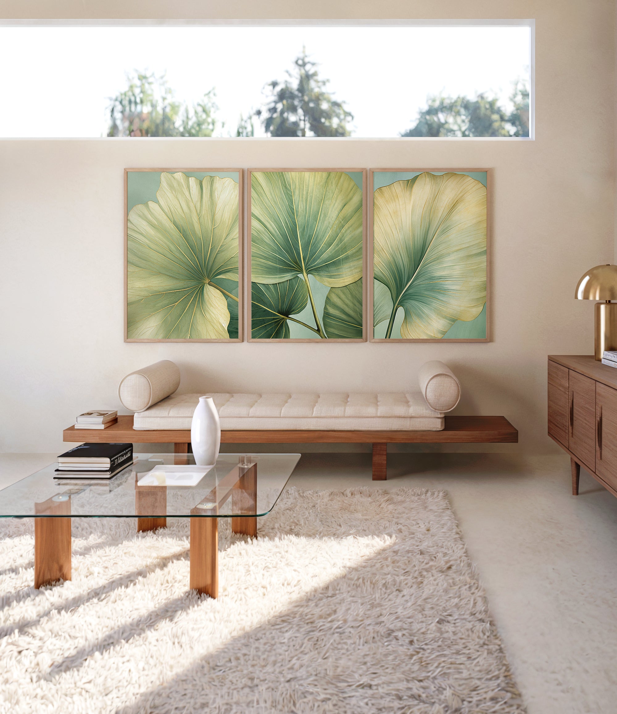 a modern living room with a large window, a glass coffee table, a sofa, and a rug. The room has a minimalist and clean design, with a focus on natural elements such as the large leaf-like artwork on the wall.