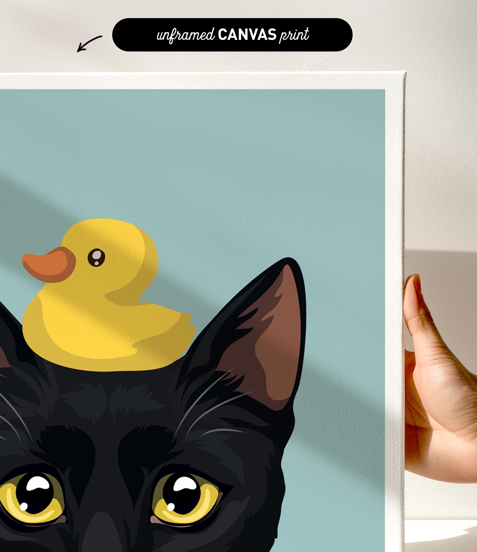 a black cat with yellow eyes and a yellow rubber duck perched on its head.
