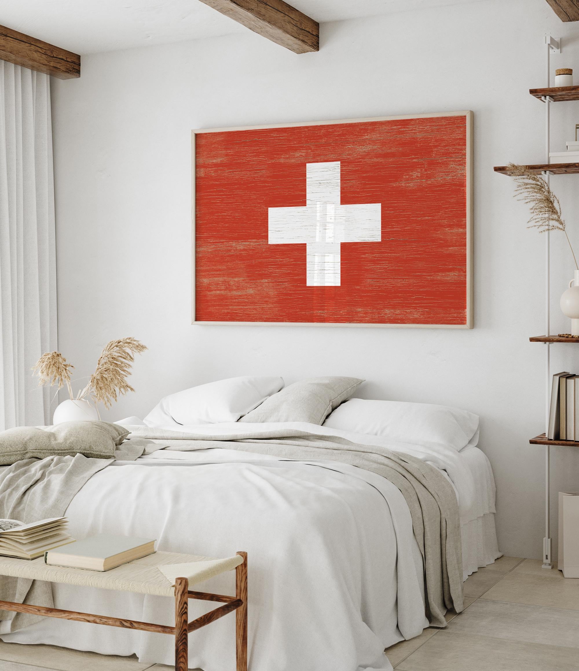 a bedroom with a bed and a painting on the wall