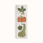 a wooden sign with vegetables painted on it