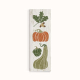 a wooden sign with vegetables painted on it