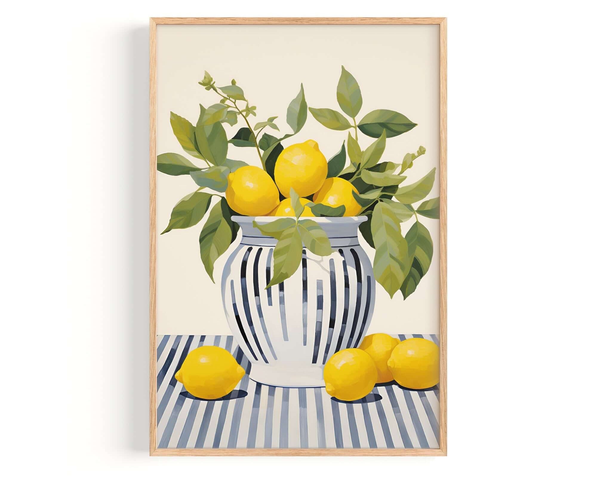 A framed painting depicting a vase filled with lemons and green leaves, placed on a striped surface.
