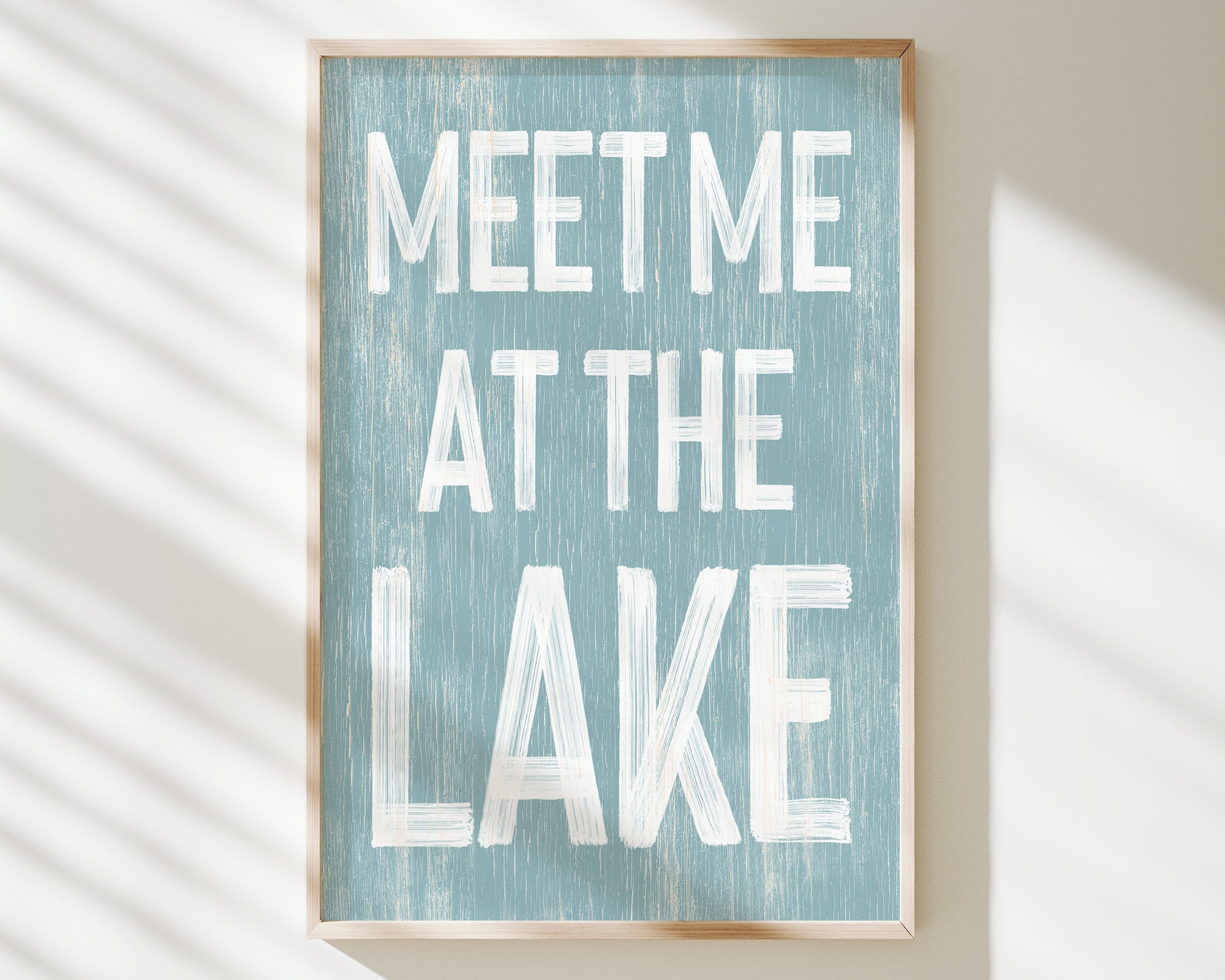 a blue and white sign that says meet me at the lake