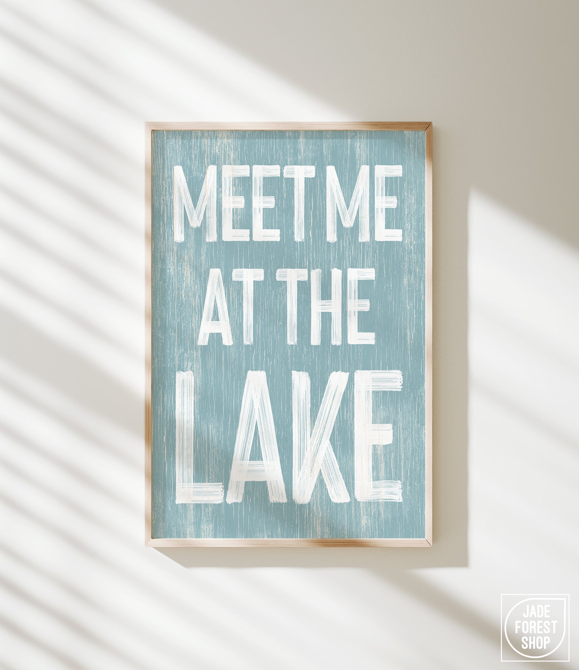 a blue and white sign that says meet me at the lake