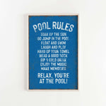 a picture of a pool rules sign hanging on a wall