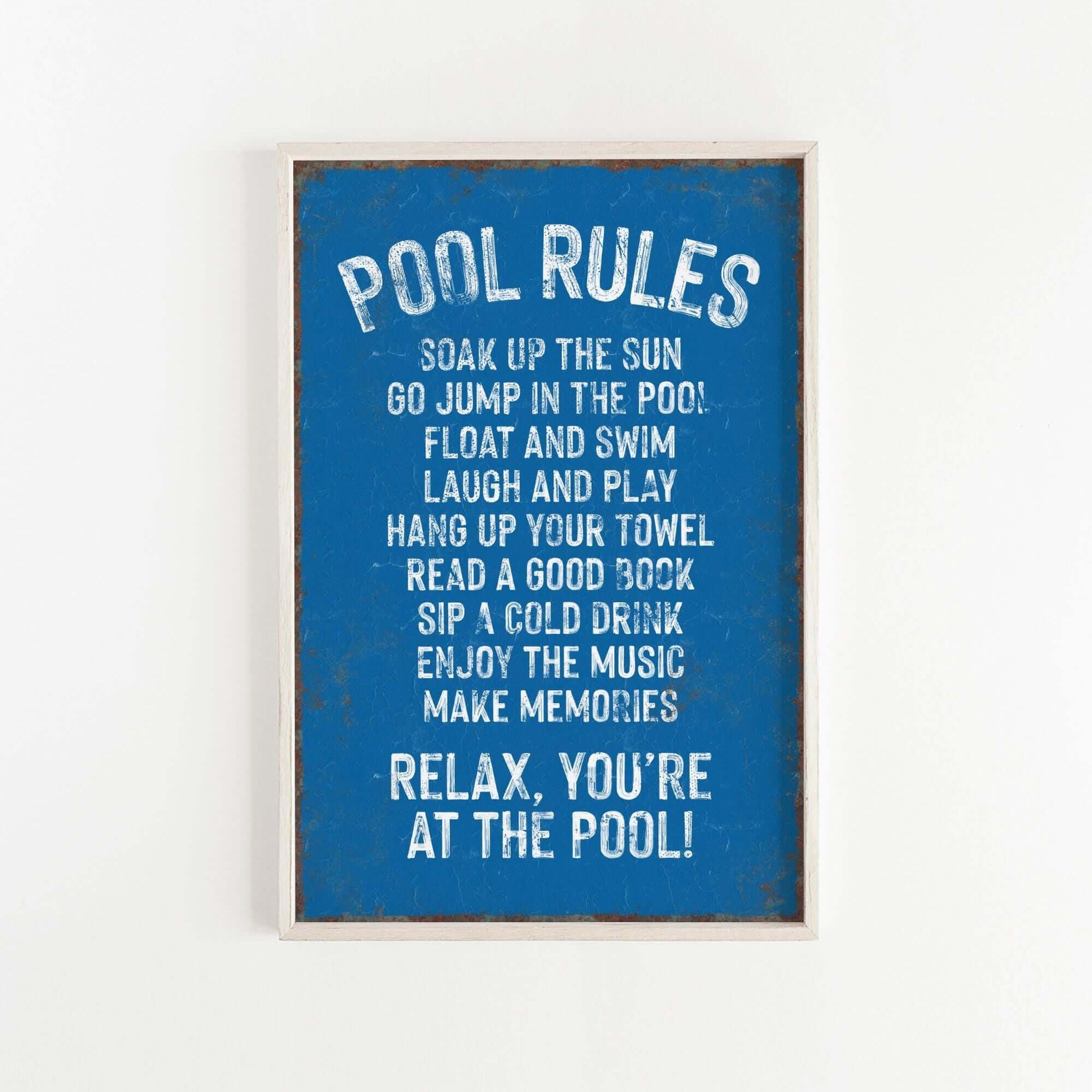 a picture of a pool rules sign hanging on a wall
