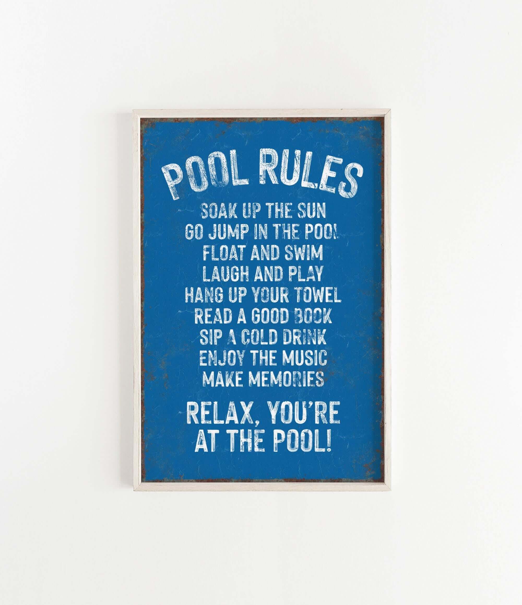 a picture of a pool rules sign hanging on a wall