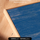 a close up of a wooden table with a blue top