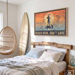a bedroom with a bed, a hanging basket, and a surfboard. Above the bed, there is a framed poster with the text "BEACH HAIR, DON'T CARE".